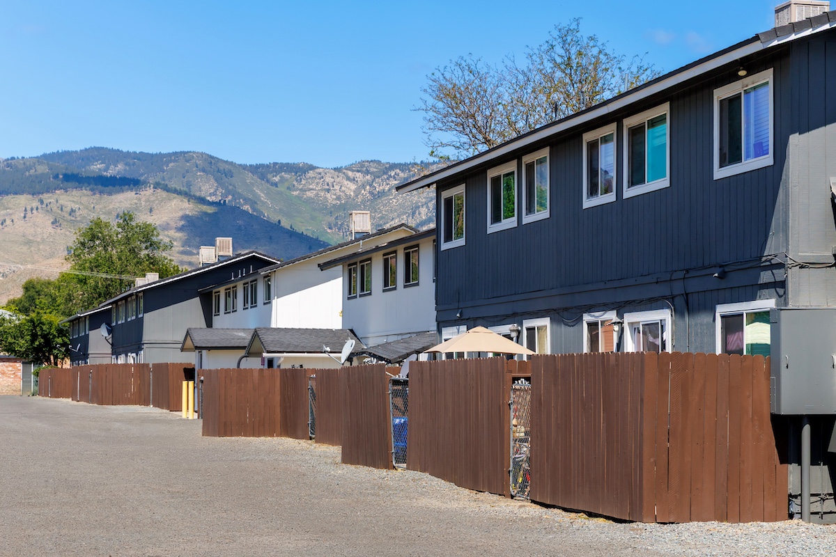 multi-family residential real estate buildings and surrounding landscape