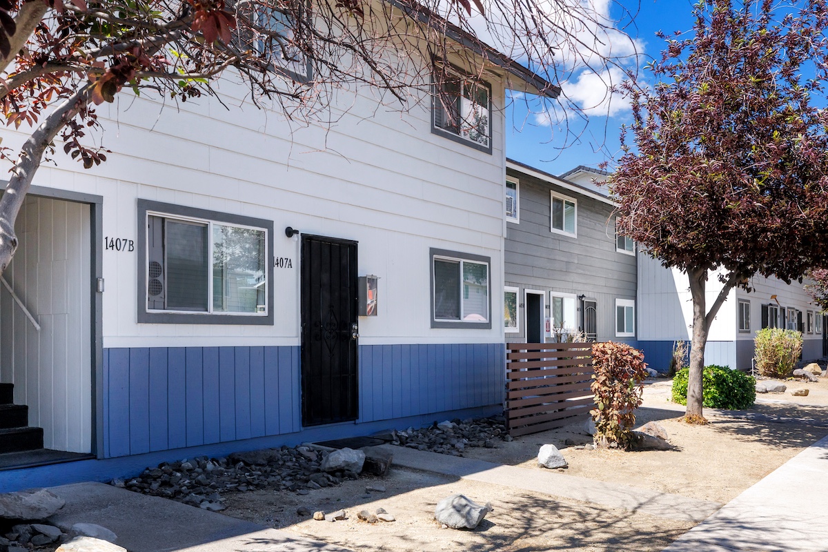 multi-family residential real estate buildings and surrounding landscape