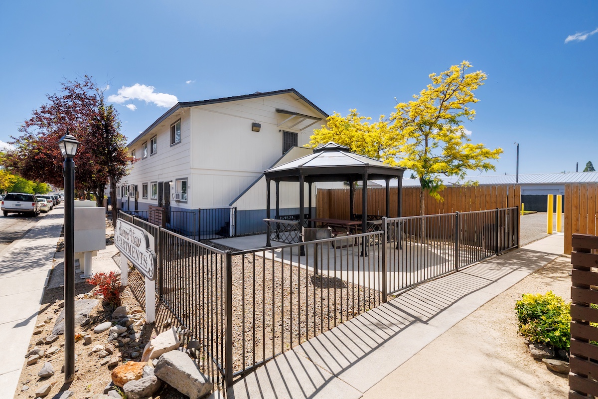 multi-family residential real estate buildings and surrounding landscape