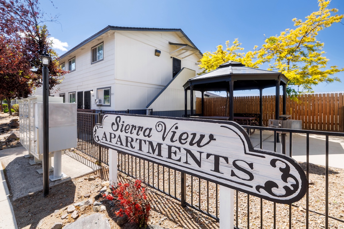 multi-family residential real estate buildings and surrounding landscape