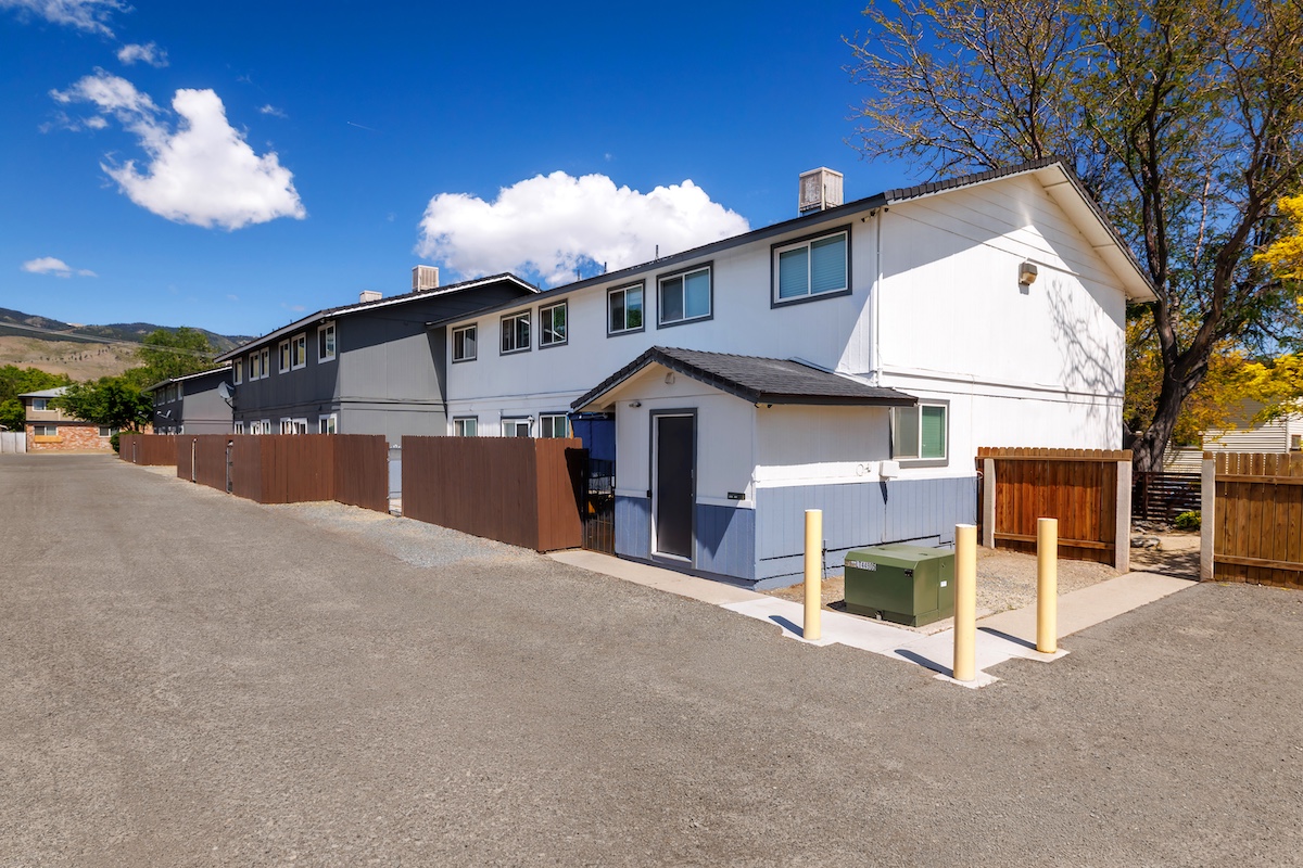 multi-family residential real estate buildings and surrounding landscape